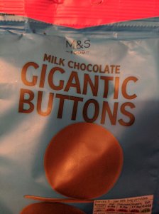 Close up of a bag of Marks and Spencers Gigantic Chocolate Buttons